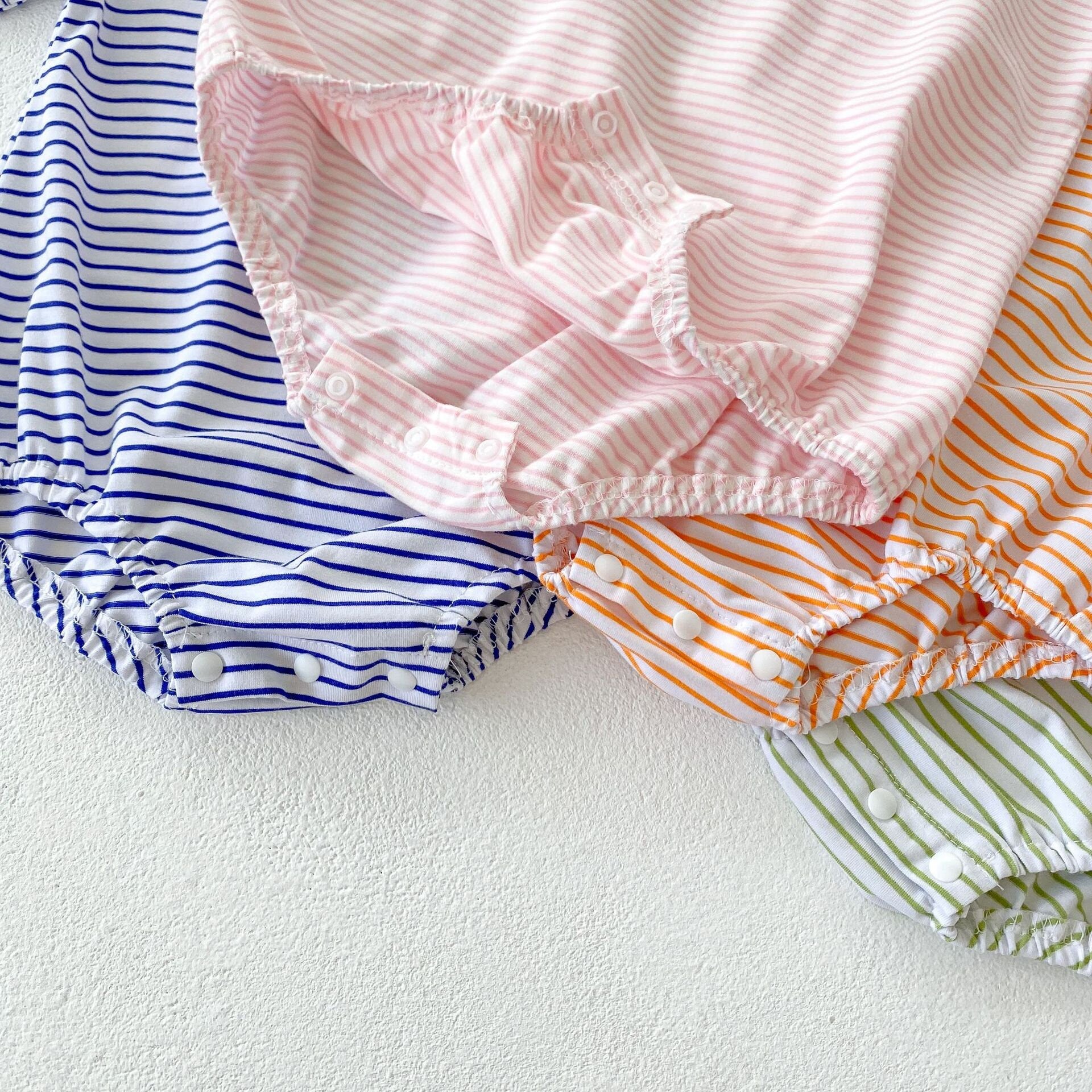 Cute oversized, bubble striped baby romper for summer/spring. Unisex, gender neutral perfect baby shower gift